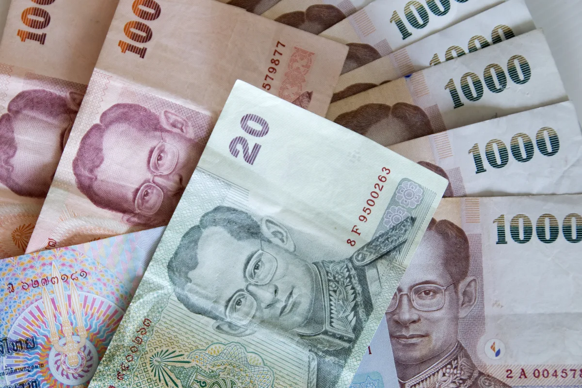 Thai baht coin and bank note lead you Thailand landmark